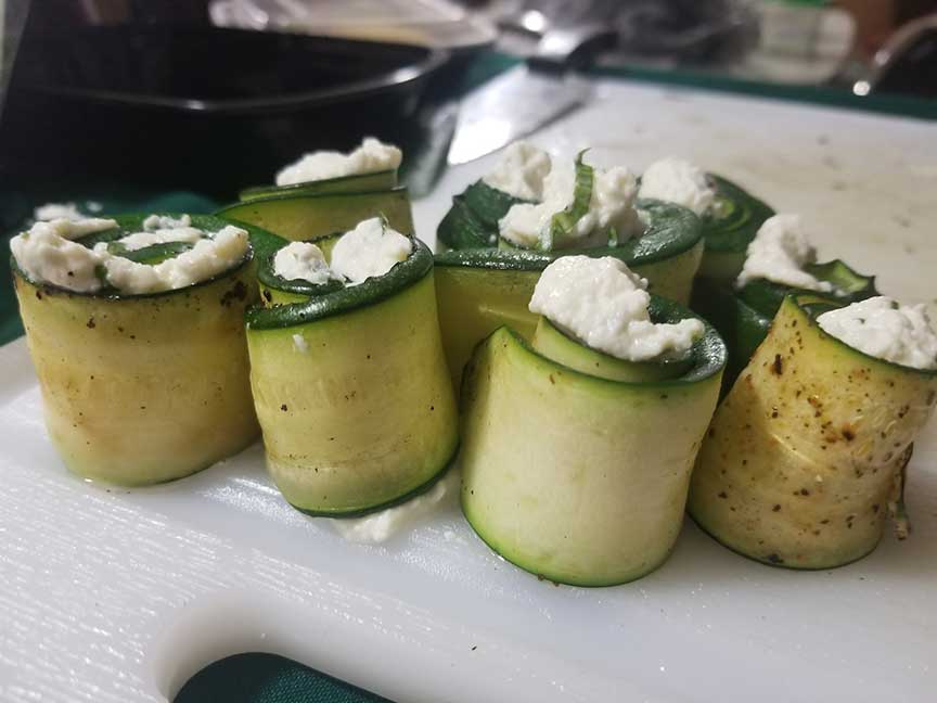 Zucchini rolls stuffed ricotta before baking